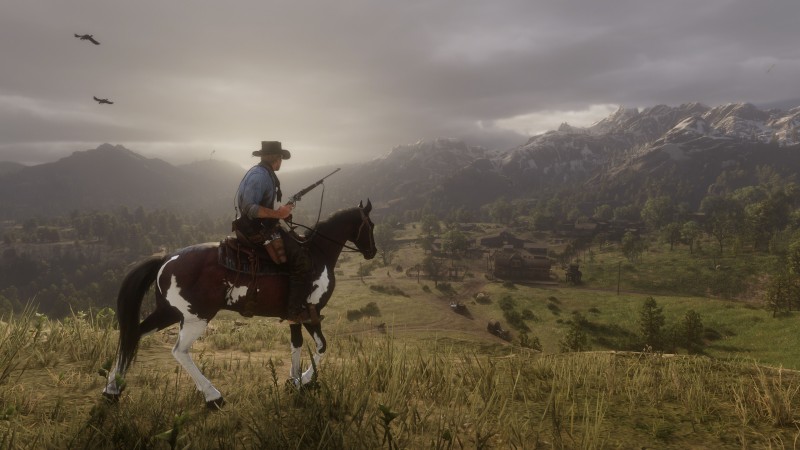 Red Dead Redemption 2 hevosen selässä ja pyssy kourassa