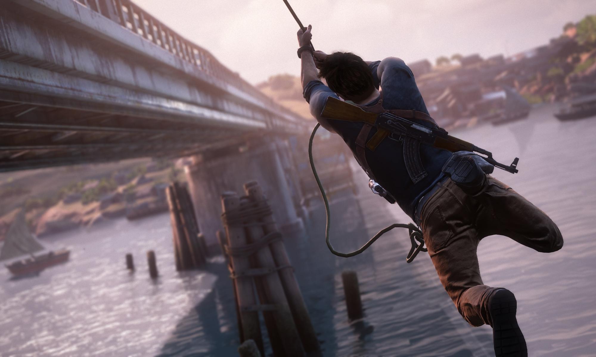 Nate köyden varassa osumassa siltaan (Uncharted 4)
